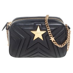 Stella McCartney Stella McCartney Schwarze gesteppte Stella Star Umhängetasche aus Kunstleder