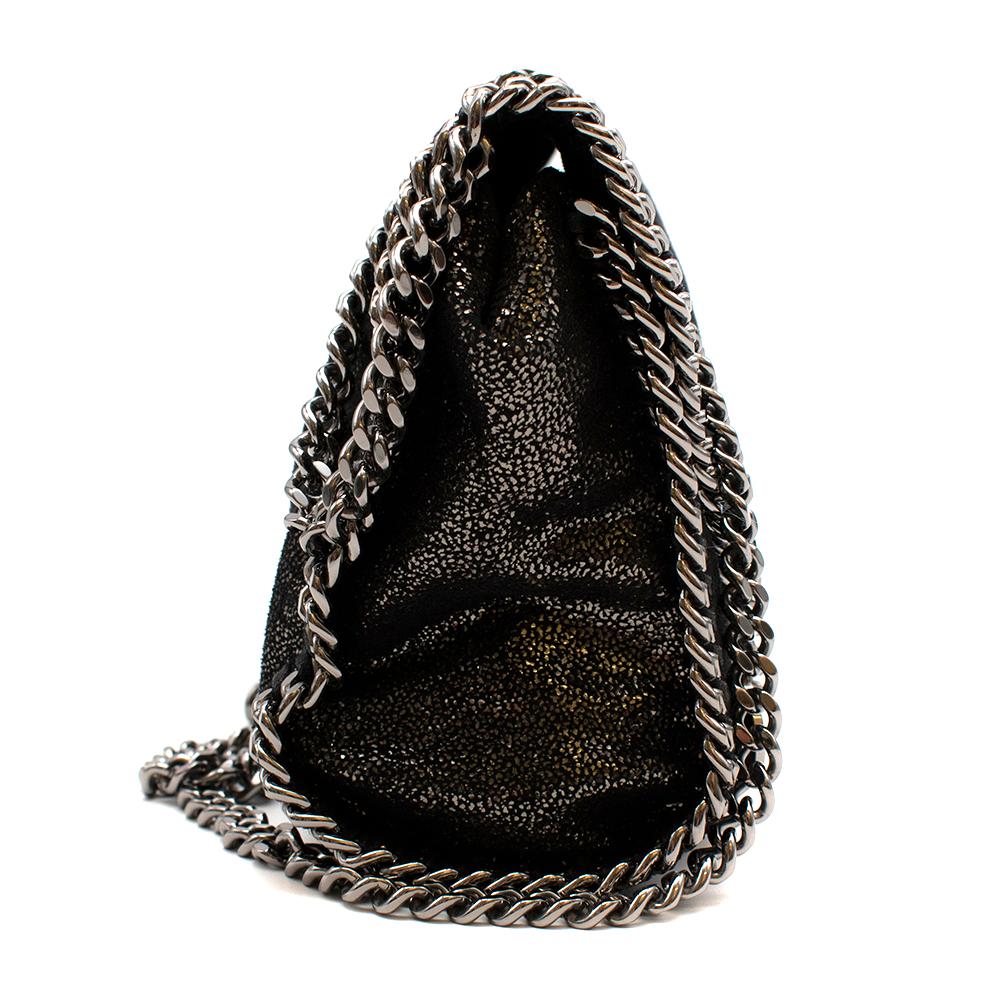 Stella McCartney Falabella Chain Cross-Body Bag

- Metallic fabric finish with silver 
- Silver tone hardware 
- Can be worn as a clutch 
- Contrast lining 
- Internal slip pocket 

Fabric Composition:
Outershell: 100% polyester
Lining: 67%