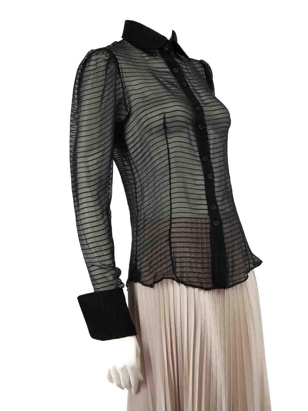 CONDITION is Good. Minor wear to shirt is evident. Light wear to hem with a small hole on this used Stella McCartney designer resale item.
 
Details
Black
Silk
Long sleeves blouse
Striped pattern
Sheer
Front button up closure
Buttoned