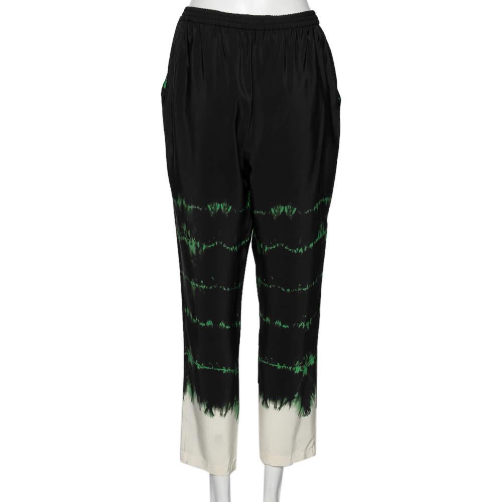 These tie-dye print Stella McCartney pants are meant to be in your closet! Cut meticulously from silk, they are finished with pockets and have a relaxed silhouette. A perfect pair to wear both indoors and outdoors.

