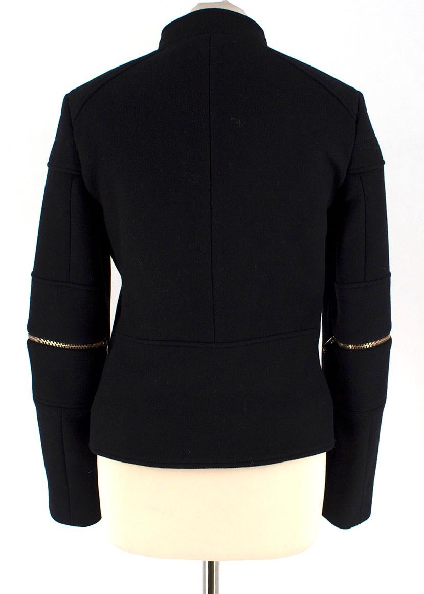Stella McCartney Black Wool-blend Jacket

- Black wool-blend jacket
- Mid-weight
- Centre-front zip fastening
- Long sleeved, zipped around the elbow 
- Stud snap fastening on the neck
- Slightly padded shoulders
- 75% wool, 25% polyamine. 50%cotton
