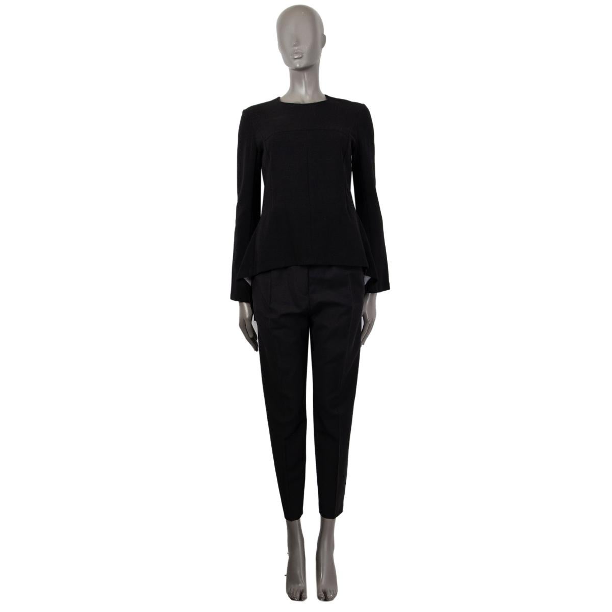 100% authentic Stella McCartney flared long-sleeve blouse in black wool (96%) and elastane (4%). Opens with a zipper on the back. Has been worn and is in excellent condition. 

Measurements
Tag Size	40
Size	S
Shoulder Width	40cm (15.6in)
Bust