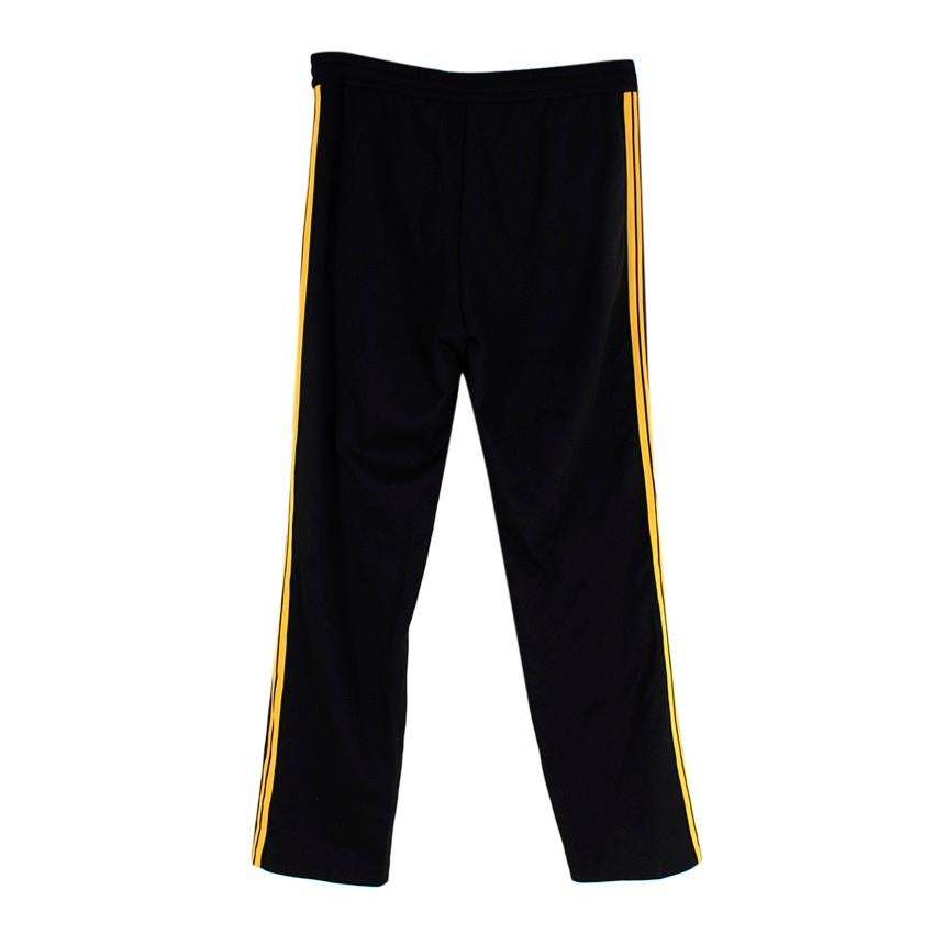 black pants with yellow stripe