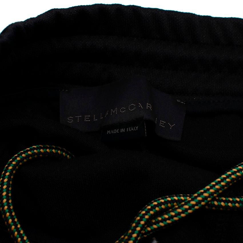 Stella McCartney: schwarz-gelbe gestreifte Trainingshose im Angebot 1