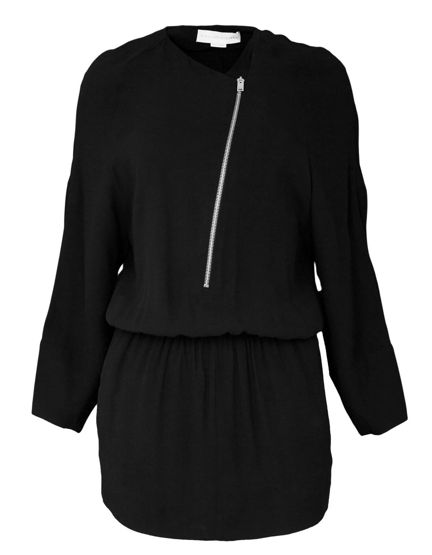 Stella McCartney Black Zip Front Tunic Sz IT38

Made In: Hungary
Color: Black
Composition: 59% rayon, 41% acetate
Lining: None
Closure/Opening: Pull over - stretch waistband
Exterior Pockets: Slit side pockets
Overall Condition: Excellent pre-owned