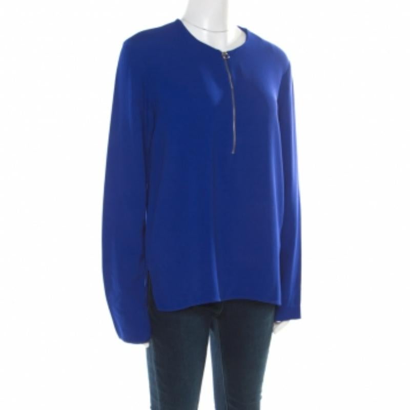 Alliant confort et style, cette blouse Stella McCartney est exactement ce que vous attendez d'elle. Fabriquée en tissu mélangé, cette pièce est simple et tendance. Il est disponible en bleu, avec des manches longues et une fermeture à glissière sur