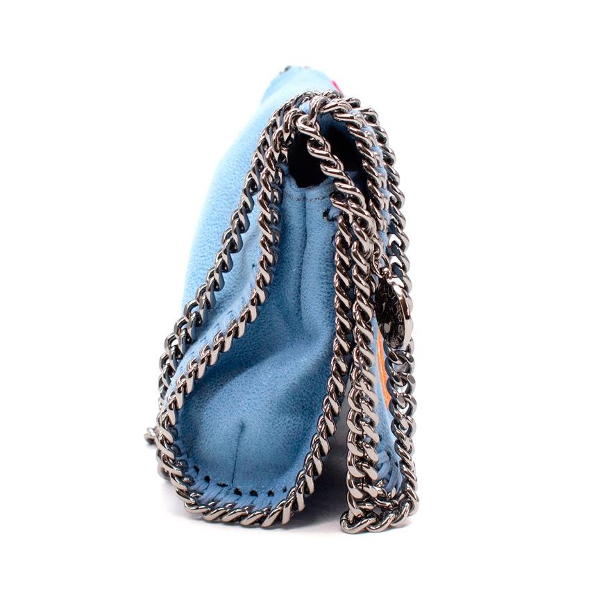 Stella McCartney Blue Ice Cream Applique Falabella Cross Body Bag
 

 - Light blue 'shaggy deer' faux leather body, with 3 ice cream appliques to the front flap in fuchsia and beige
 - Signature silver-tone chain edging and strap
 - Satin lined with