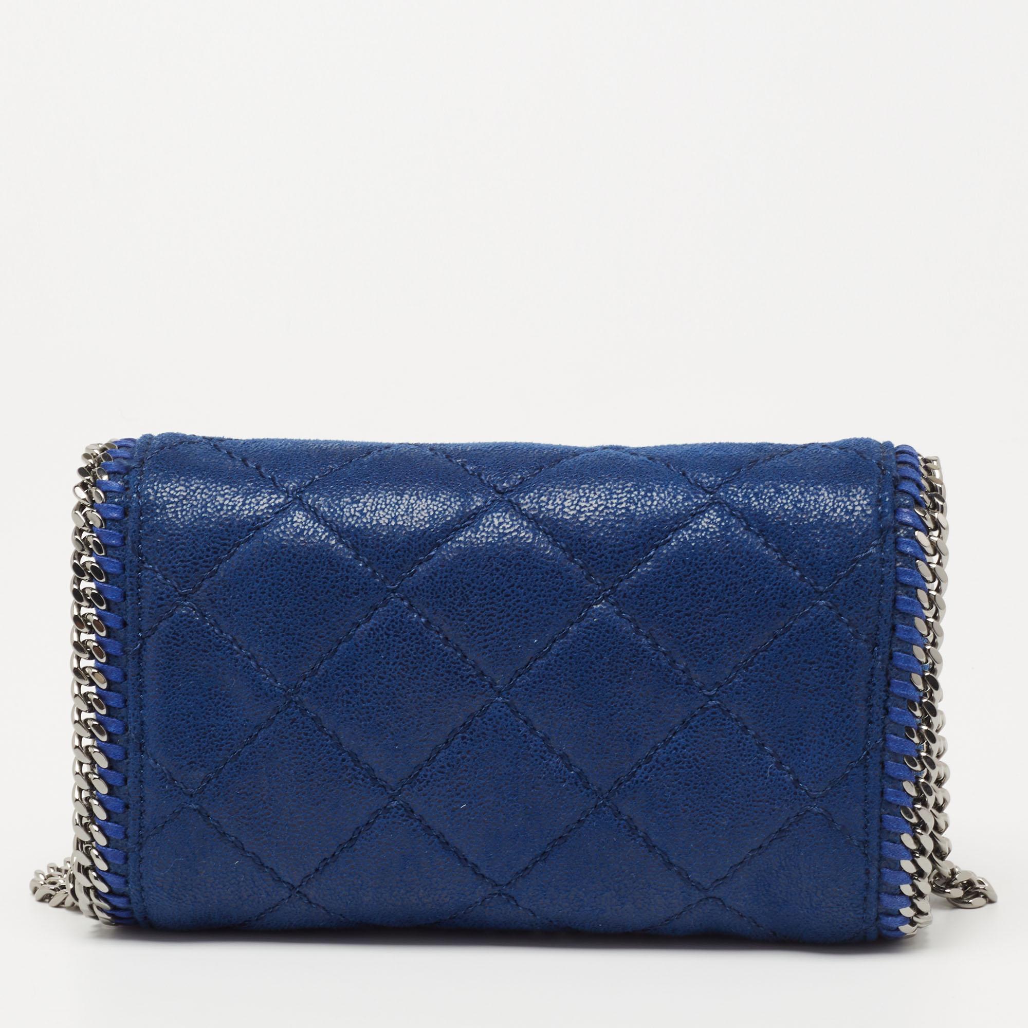 Elegance meets luxury in this Falabella shoulder bag from House of Stella McCartney. It is created using blue quilted faux suede on the exterior. It has a roomy fabric-lined interior, gunmetal-tone hardware, and a 57 cm strap. This bag will elevate