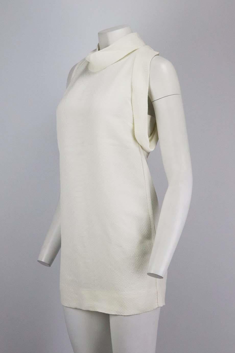 This 'Bretta' dress by Stella McCartney is crafted from snake-effect matelassé for a soft raised texture, mirror the presentation styling and maximize the flattering A-line cut with tonal heels. White rayon. Hook and eye fastening at back. 100%
