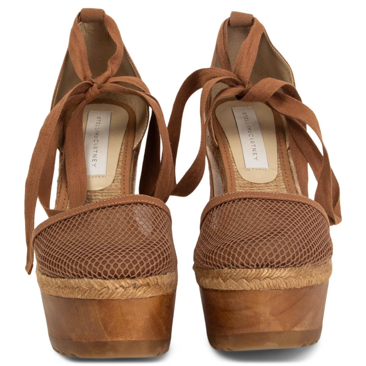 100% authentic Stella McCartney brown wooden and mesh espadrilles ankle strap wedges. Have been worn and are in excellent condition. 

Shoe Size	38
Inside Sole	25cm (9.8in)
Width	8cm (3.1in)
Heel	12cm (4.7in)
Platform:	5cm (2in)

All our listings
