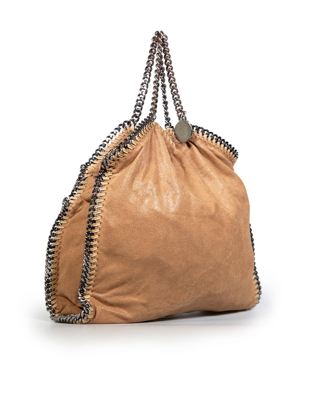 CONDITION is Good. Minor wear to the bag is evident, the lace-up trimming around the edges of the bag are discoloured. The top handle chain and the snap closure are tarnished and there are marks on the lining of this used Stella McCartney designer