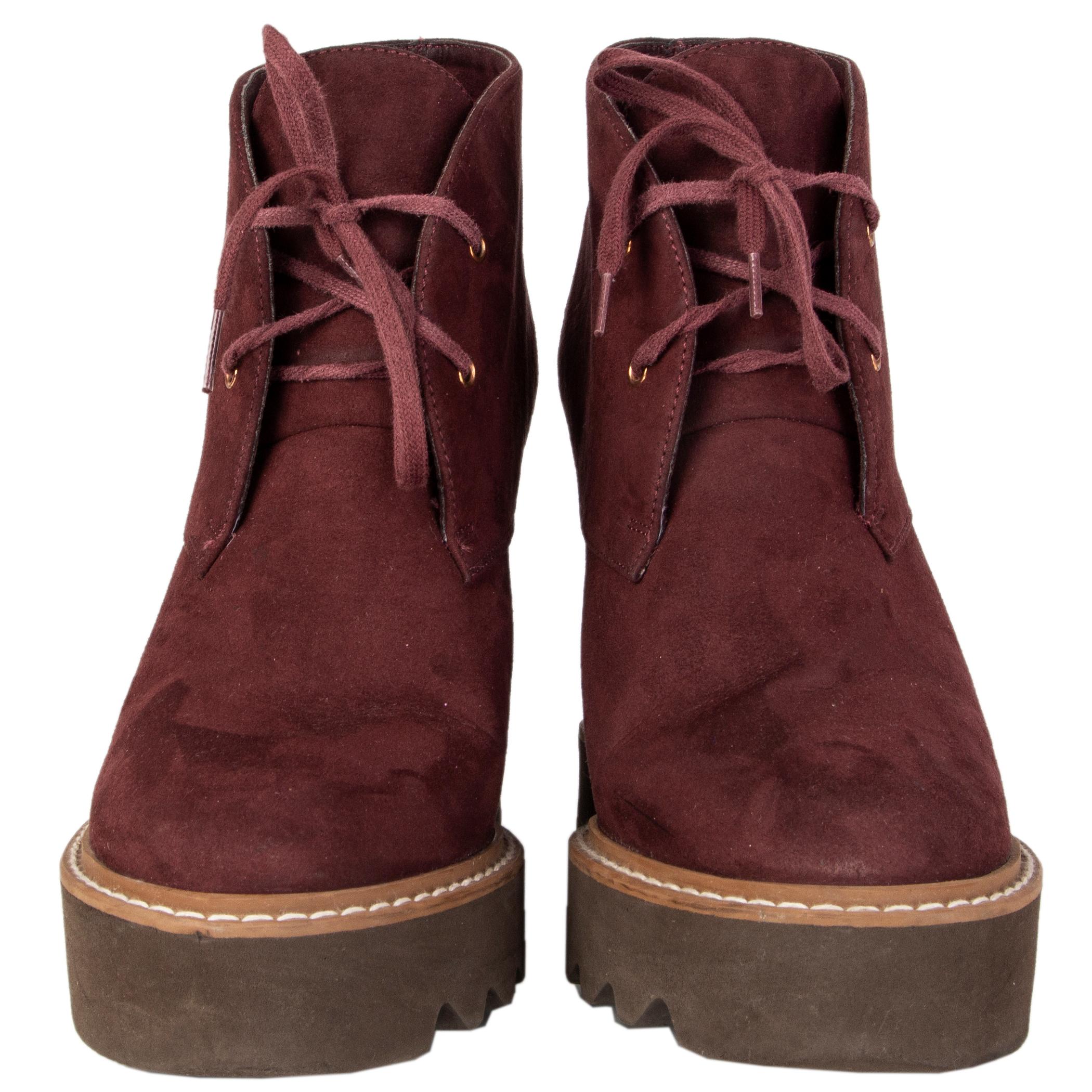 100% authentic Stella McCartney 'Leana' lace-up platform ankle boots in burgundy faux suede with a brown wooden wedge heel featuring a chunky brown rubber sole. Have been worn and are in excellent condition. 

Measurements
Imprinted Size	38
Shoe