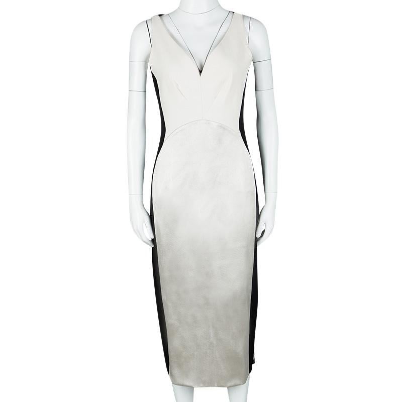 You're sure to look your best when you flaunt this Stella McCartney dress at formal gatherings. Created from the finest materials, the dress features a colourblock style with a V neck and a vent at the back. A pair of glossy black pumps will