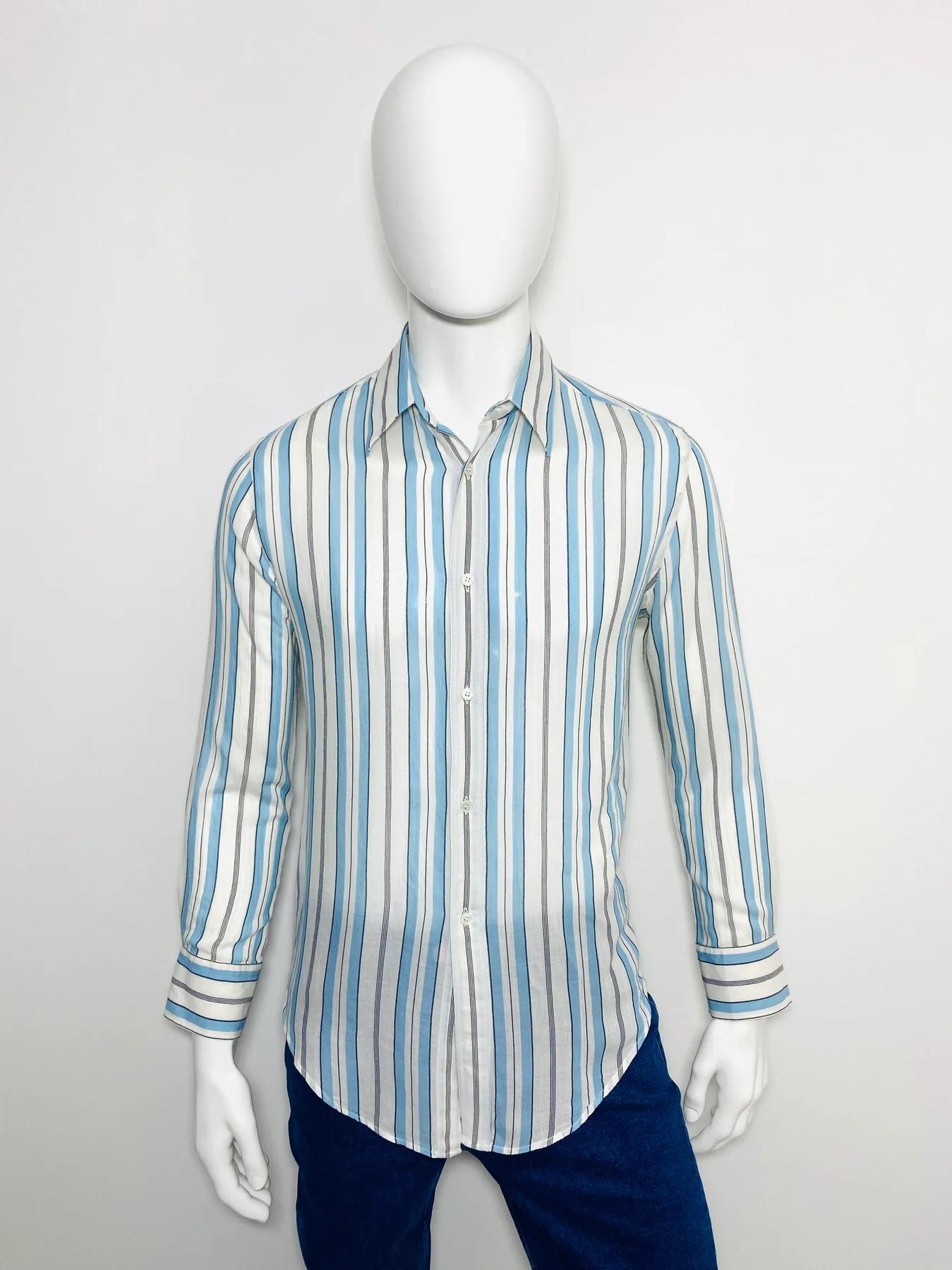 Stella Mccartney Cotton Long Sleeved Shirt

White with blue and black vertical stripes. Buttons fastening to the front.

Additional information:
Size – 40
Condition – Very Good