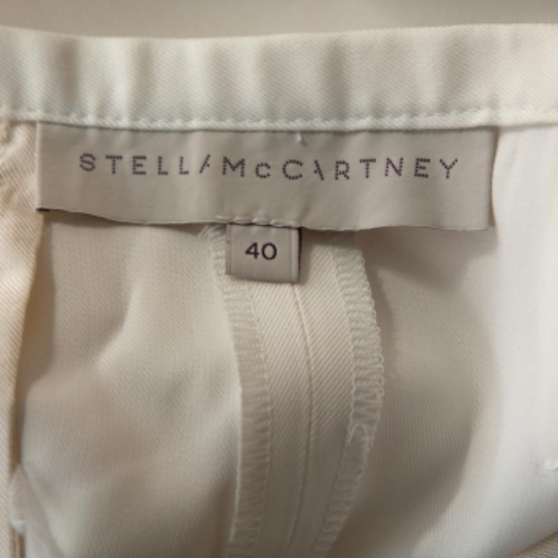 De las mujeres Stella McCartney Pantalones cónicos de seda recubierta color crema con detalle de botones S en venta