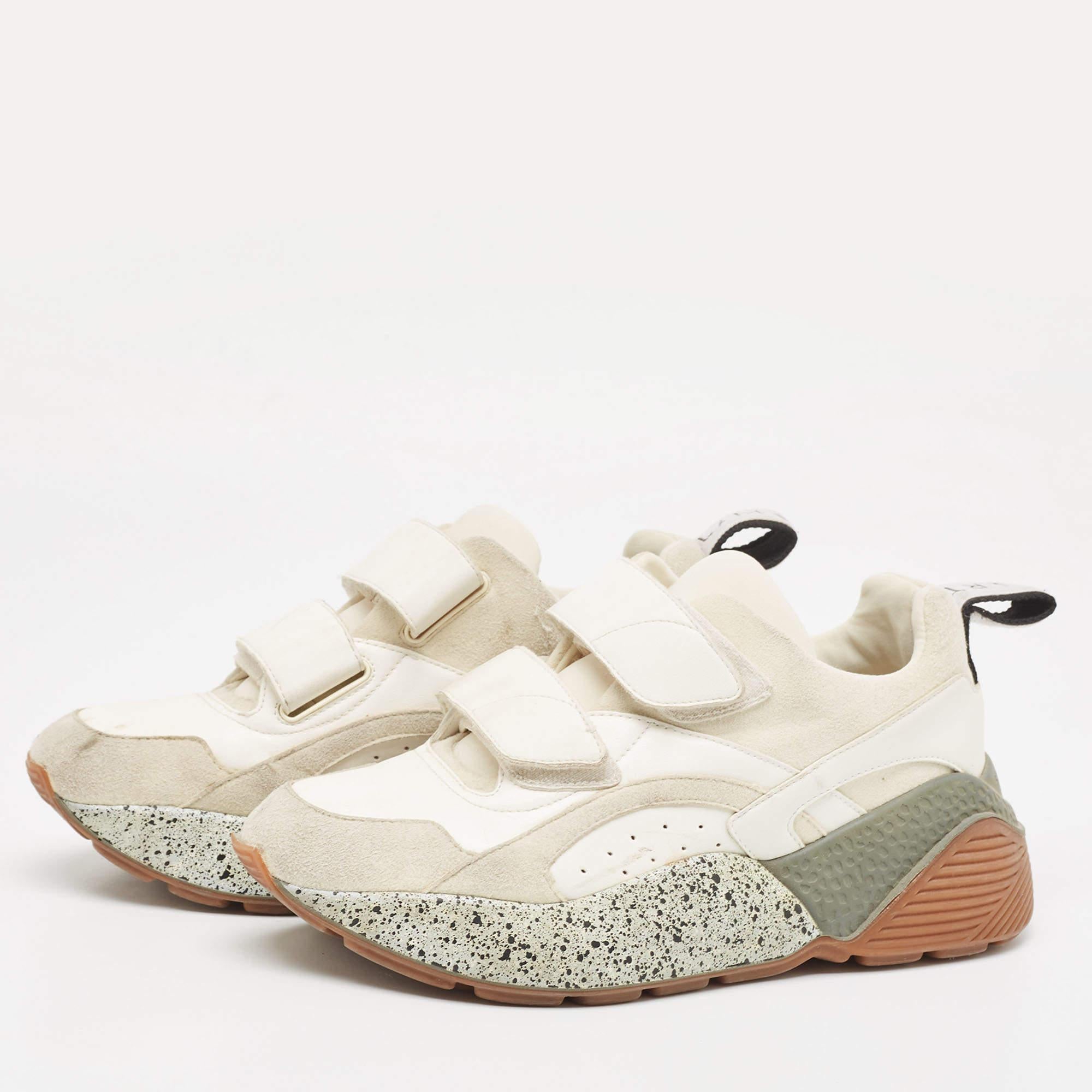 Stay in comfort with these chic sneakers from Stella McCartney. Crafted with faux suede and faux leather, this chunky pair has textured rubber soles, logo detailing on the pull tabs, and velcro straps on the front. Smooth insoles complete these