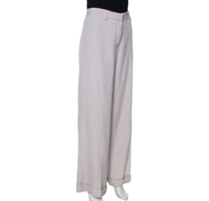Everything about these Stella McCartney trousers speaks comfort and ease. The pair has been knit using quality materials and cut into a wide-leg style with belt loops & a button closure. Wear the trousers with a simple top or shirt and flat slides