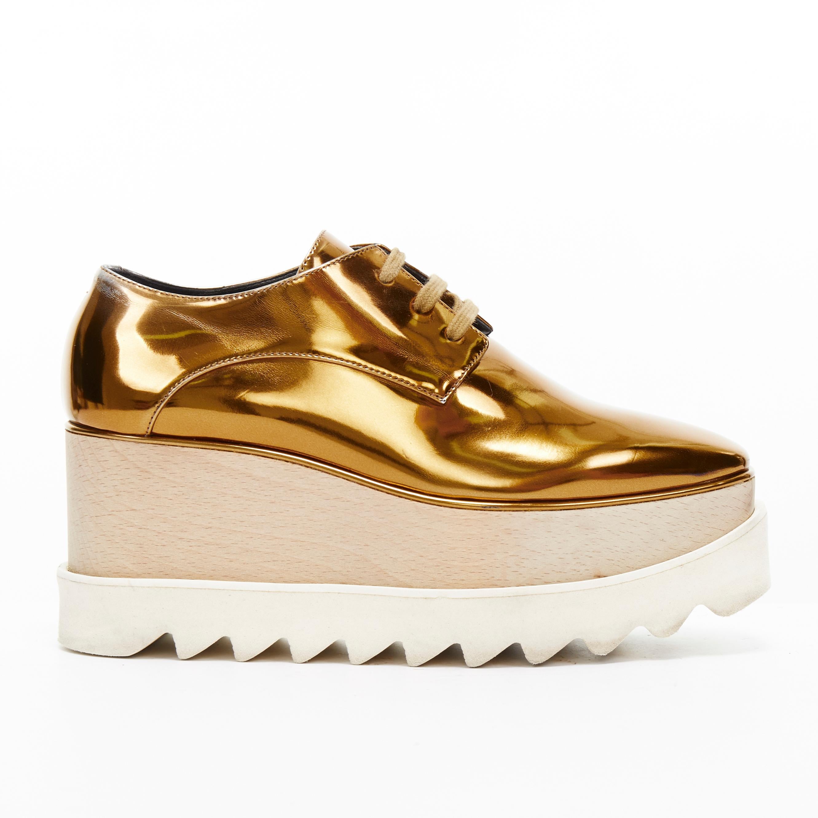 STELLA MCCARTNEY Elyse mirrored gold faux leather wooden platform brogue EU34.5 
Reference: TGAS/A03039 
Brand: Stella McCartney 
Model: Elyse 
Material: Faux leather 
Color: Gold 
Pattern: Solid 
Closure: Lace Up 
Extra Detail: Elyse platform