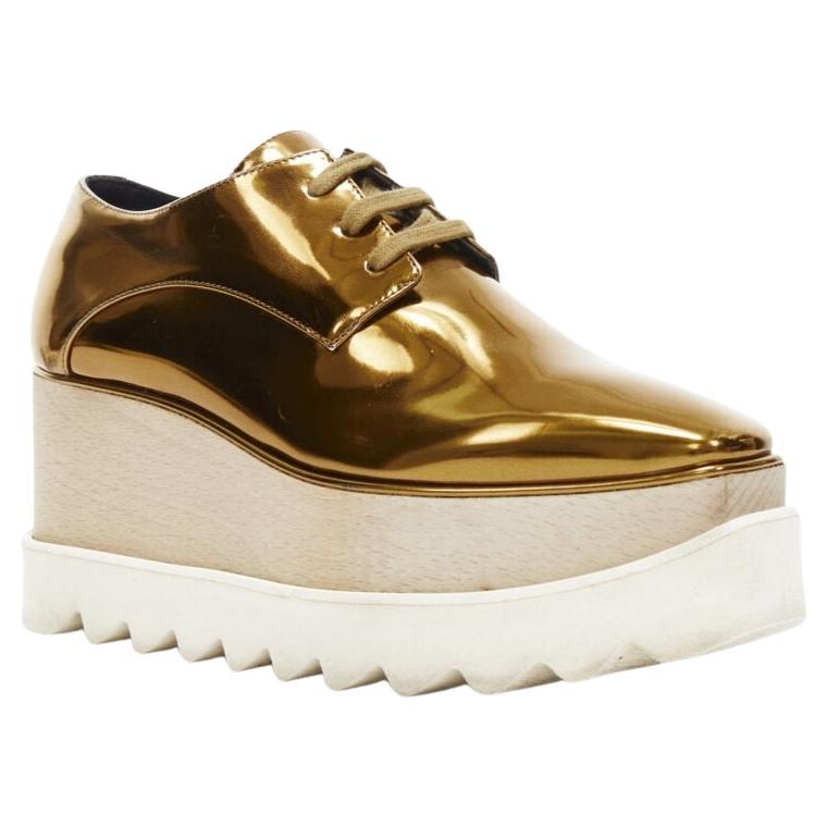 STELLA MCCARTNEY Elyse mirrored gold faux leather wooden platform brogue EU34.5
Reference: TGAS/A03039
Brand: Stella McCartney
Designer: Stella McCartney
Model: Elyse
Material: Faux Leather, Rubber
Color: Gold, Brown
Pattern: Solid
Closure: Lace