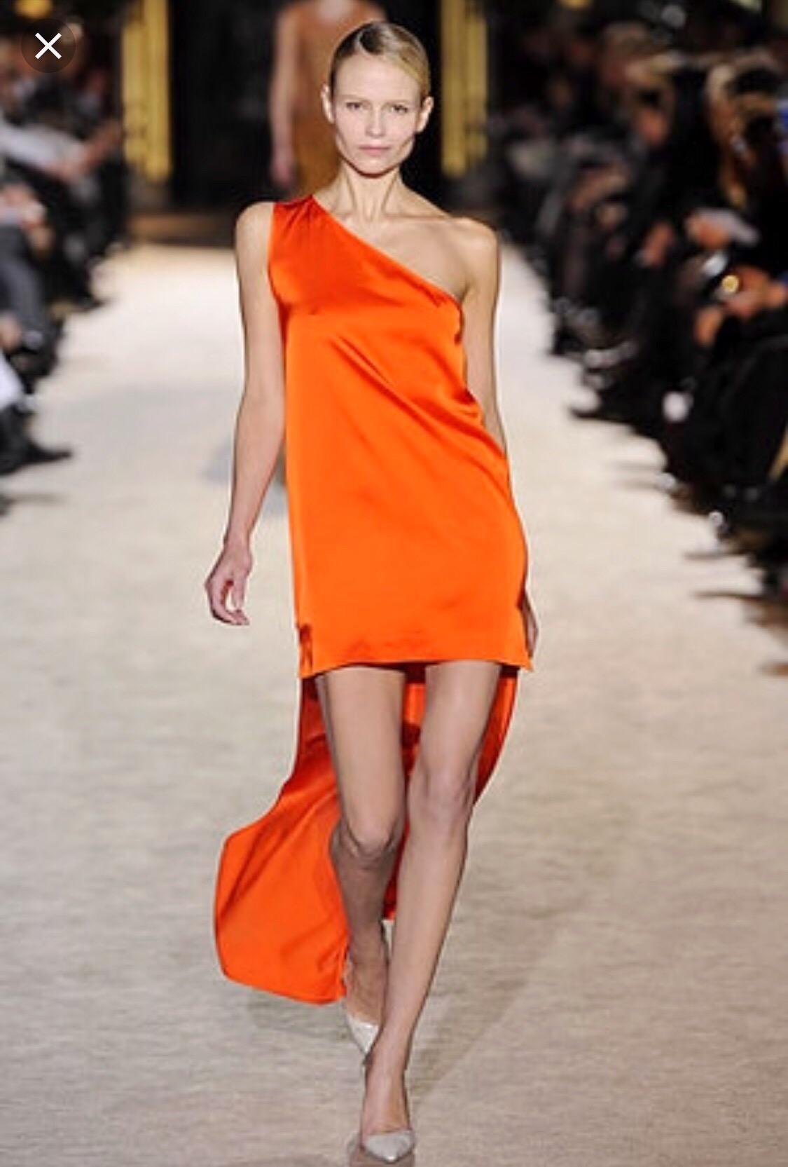 Beautiful STELLA MCCARTNEY Fall / Winter 2010 bright orange one shoulder rayon toga runway dress! Though the dress on the runway featured a long train, this version is much more practical. Drapes the body beautifully, and really camouflages any