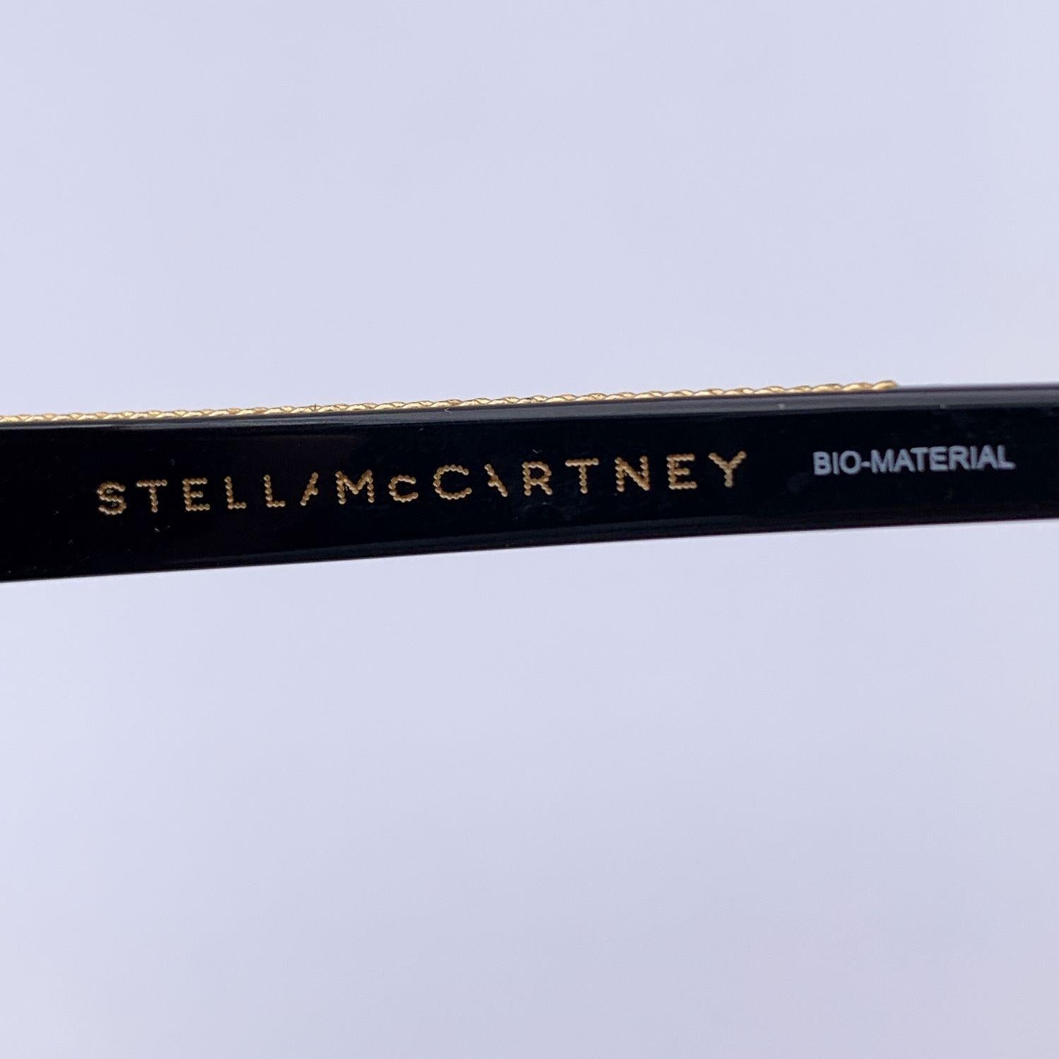  Stella McCartney - Lunettes de soleil Falabella Aviator SC0030S 57/14 145 mm Unisexe 