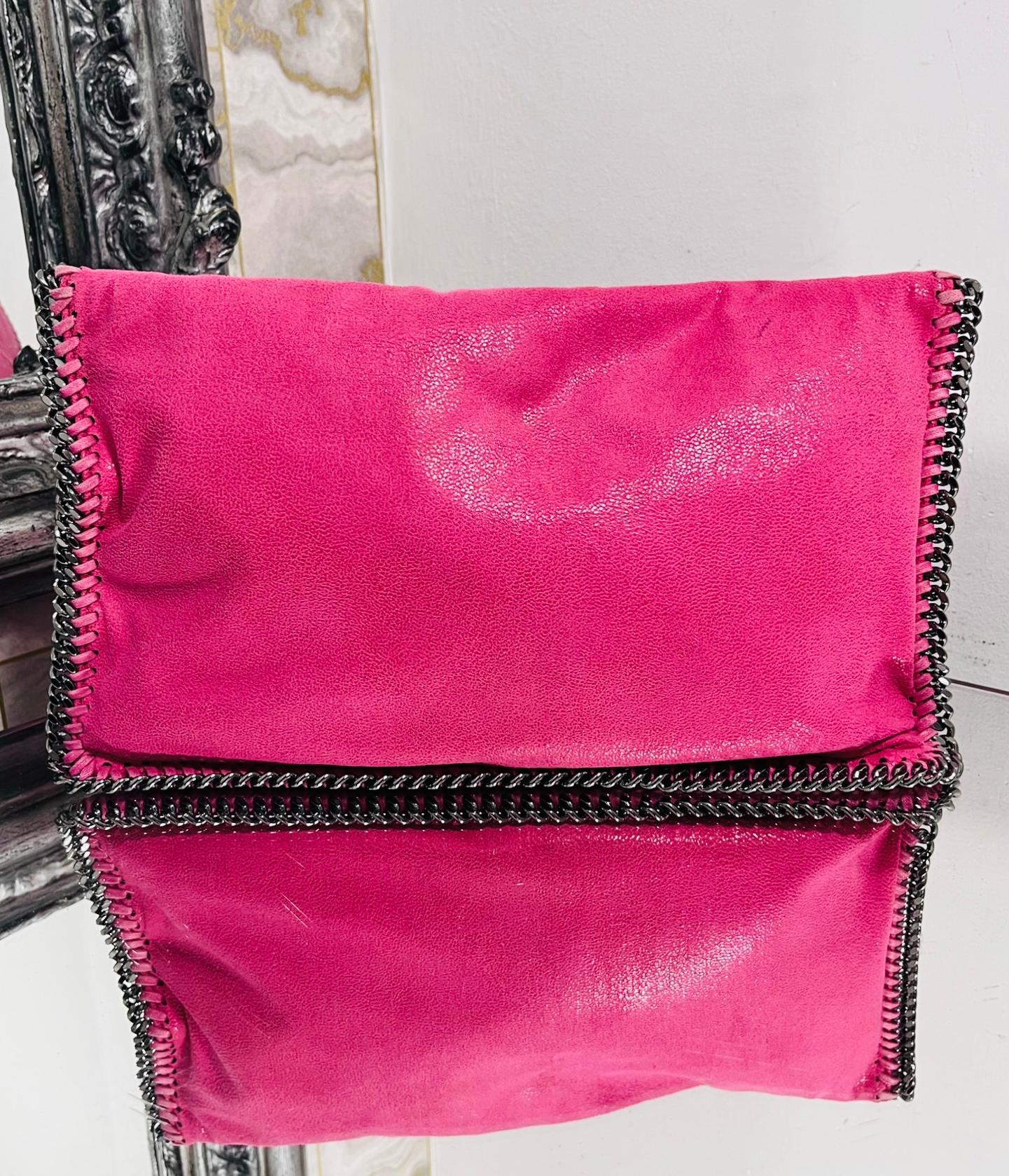 Stella McCartney Falabella Clutch Bag

Bright pink, rectangle shaped clutch bag trimmed with the style's signature gunmetal chain.

Detailed with 'Stella McCartney' logo engraved metal tag.

Featuring snap flap closure leading to logo lined interior