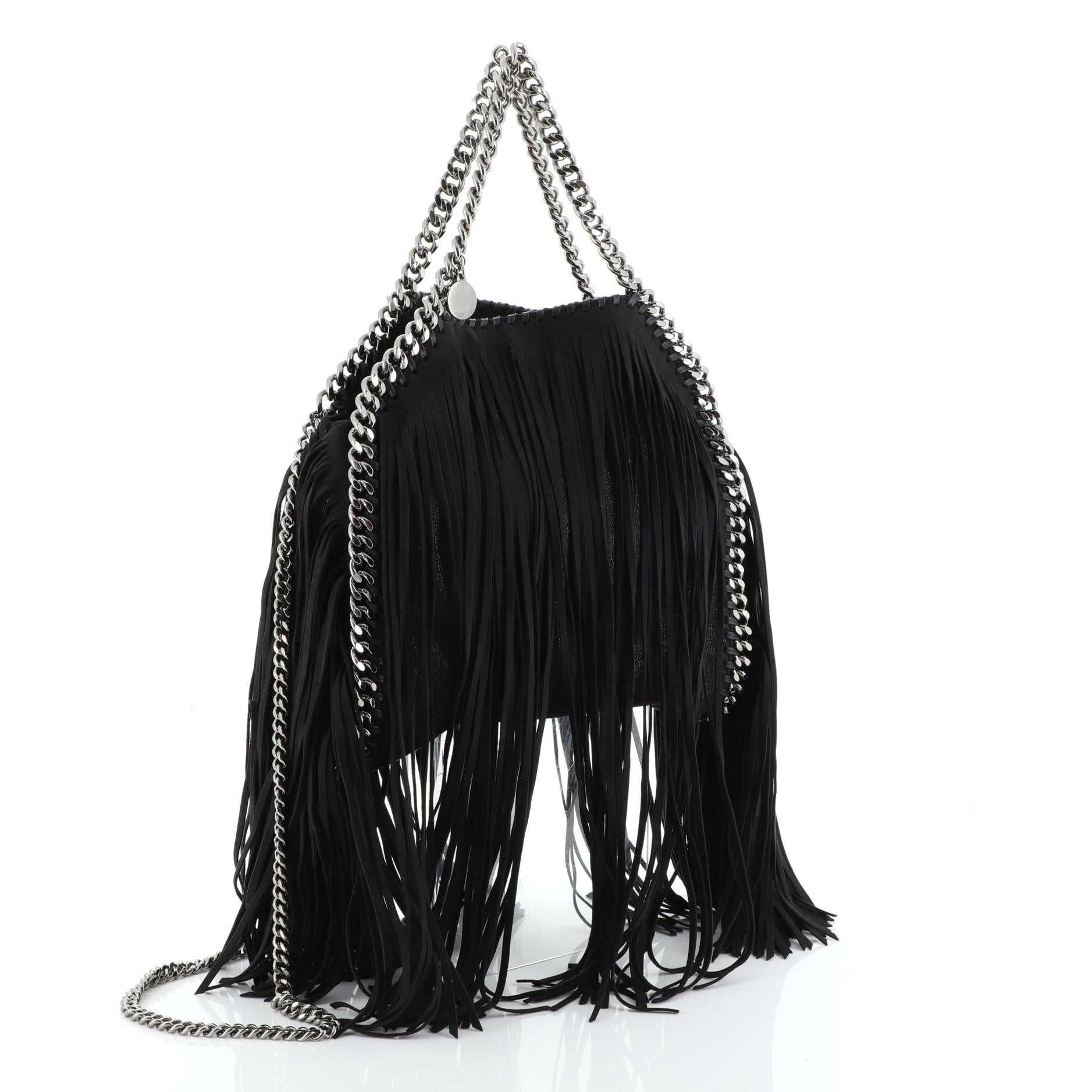 This authentic Stella McCartney Falabella Fringe Fold Over Crossbody Bag Shaggy Deer Mini is perfect for casual day-to-day excursions with an edgy twist. Crafted in dark brown fringe shaggy deer, this luxurious bag features slinky chain handles,