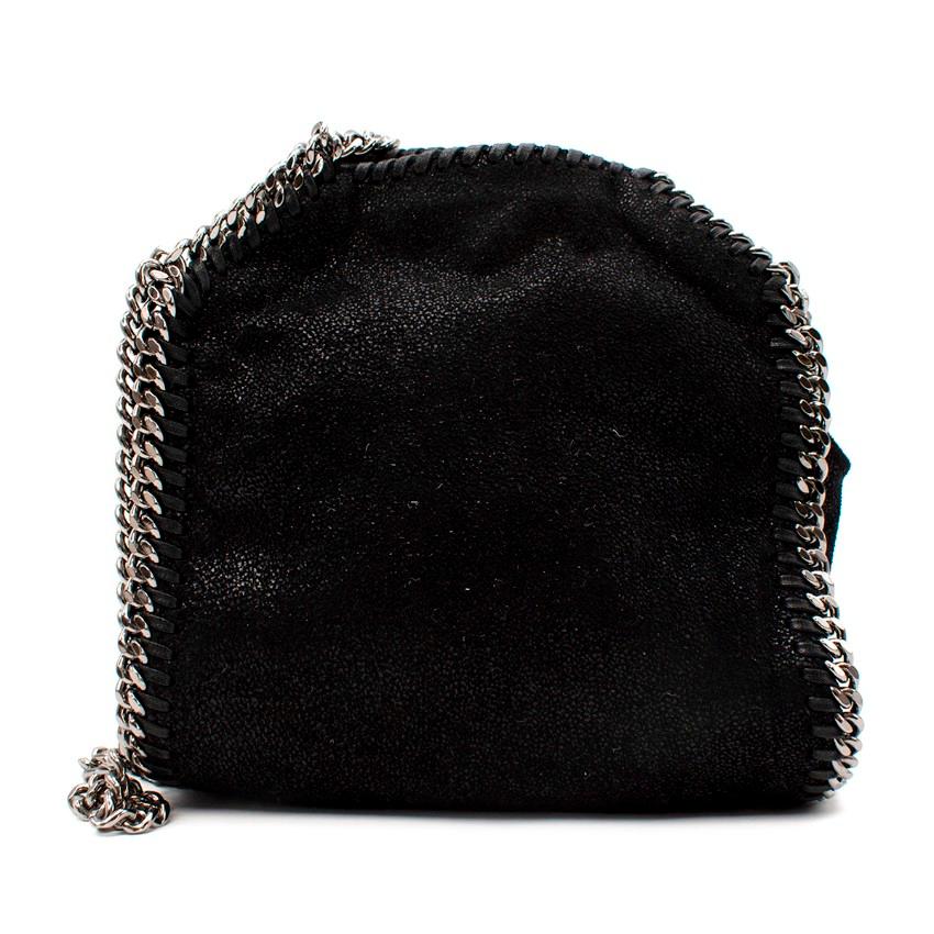 Stella McCartney Falabella Tiny Black Shaggy Deer Cross Body Bag
 

 - Falabella tiny rendered in the Brand's signature shaggy deer faux suede material
 - Silver-tone hardware including a hanging logo medallion
 - Magnetic closure
 

 Materials:
