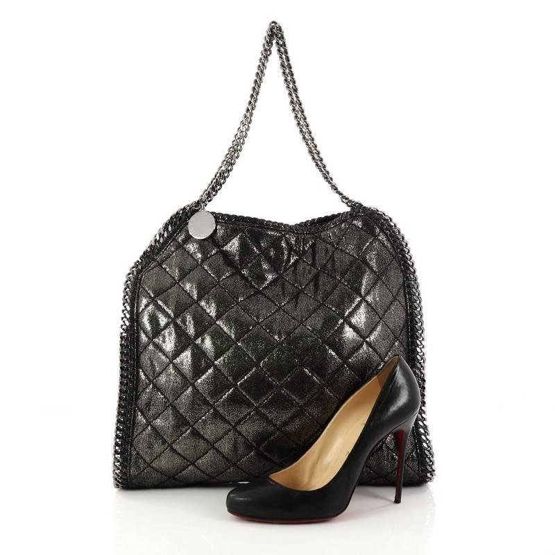 This authentic Stella McCartney Falabella Tote Quilted Shaggy Deer Small is perfect for casual day-to-day excursions. Crafted from black metallic quilted shaggy deer, this no-fuss, lightweight tote features gunmetal chain link strap and trims,