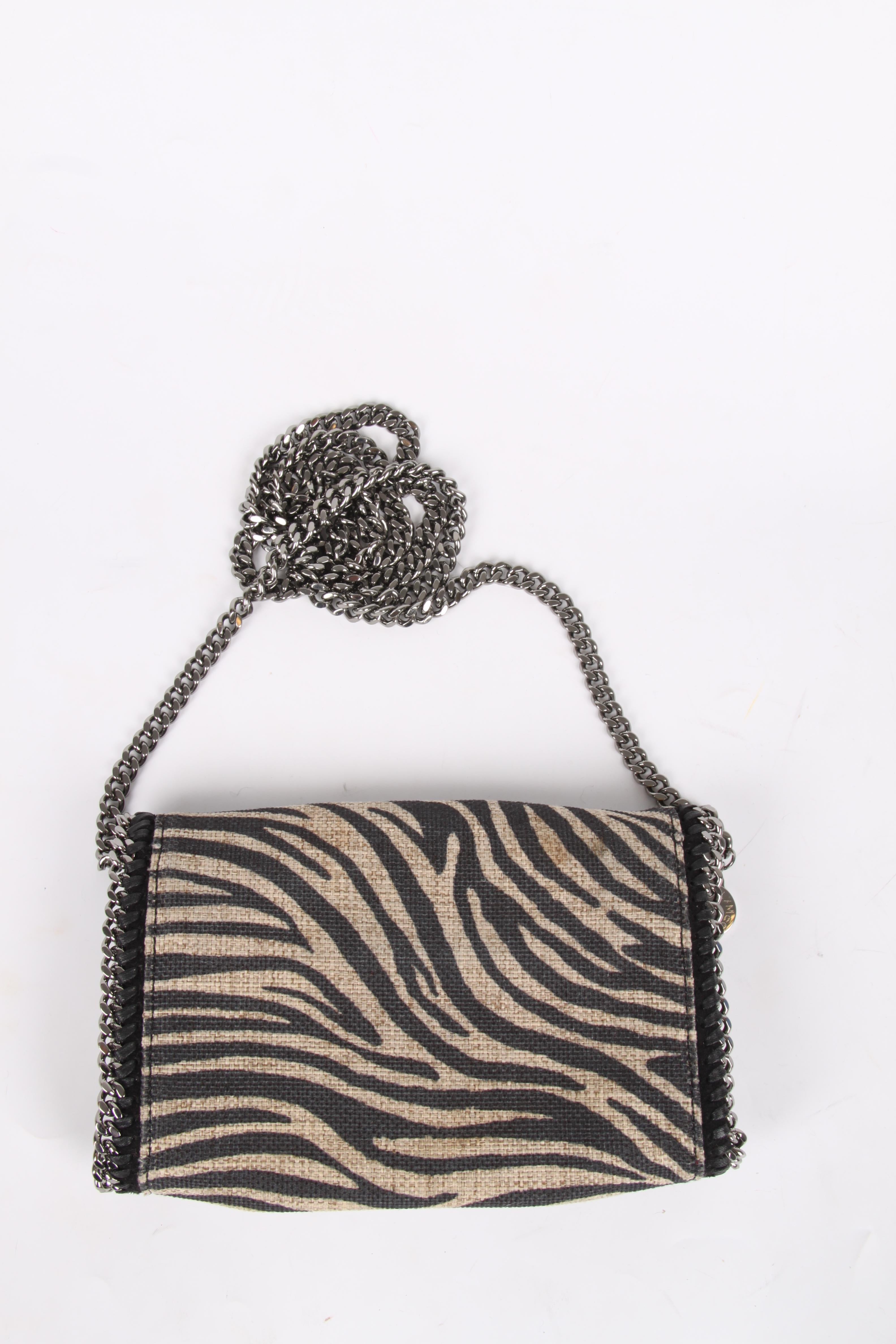 Stella McCartney is known for her use of animal friendly and durable materials. Go Stella!

This Falabella Zebra Shoulder Bag is made of canvas. Supple material executed in a beige color with black zebra stripes and embellished with silver-tone