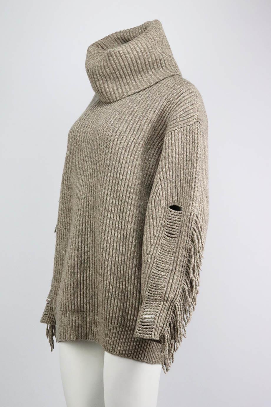 This sweater by Stella McCartney is spun from regenerated cashmere blended with wool for softness, the hand-finished fringing on the sleeves reflects the playful energy of the collection. Beige cashmere-blend. Slips on. 95% Cashmere, 5% wool. Size: