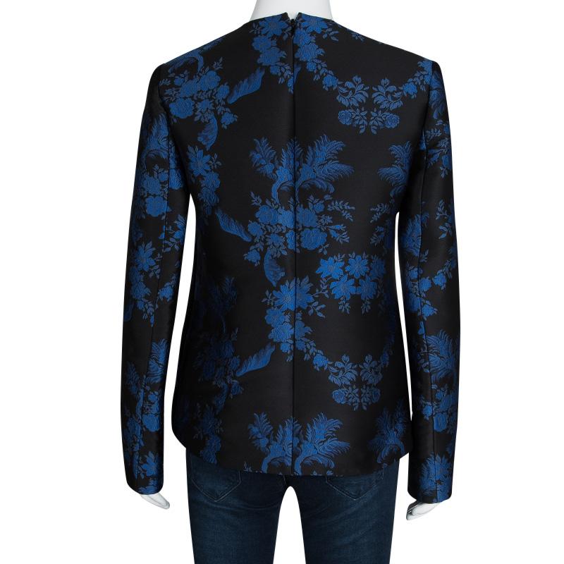 This top from Stella McCartney’s F/W 16 collection has us captivated! Set in a beautiful jacquard floral print in blue. The black top is patterned with long sleeves, high neck and back zipper opening. Flaunt this black beauty at high tea events,