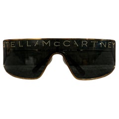Stella McCartney Gold Logo Studded Shield Sunglasses