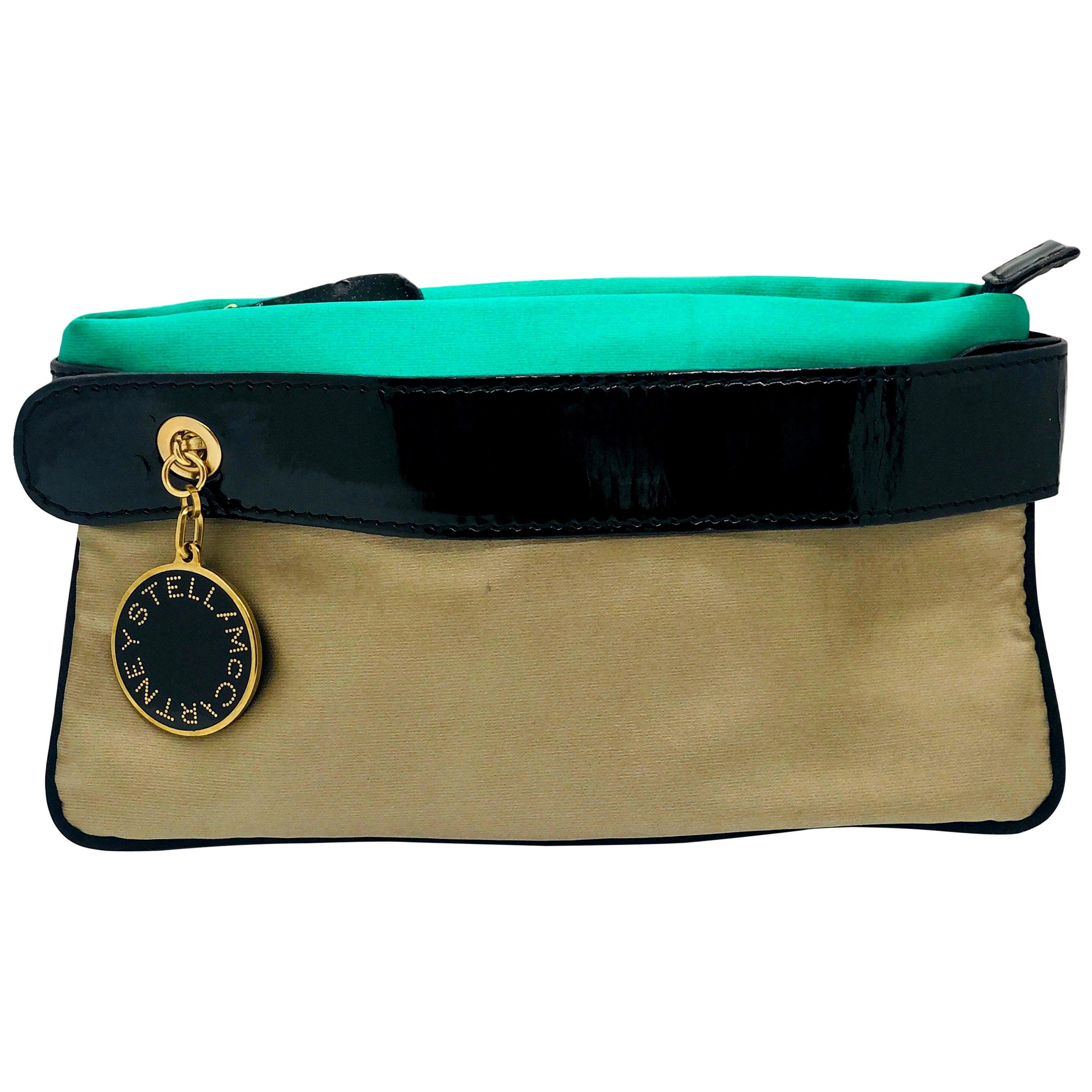 Make:  Stella McCartney
Place of Manufacture:  Italy
Type:  Clutch
Color:  Mint green, champagne, khaki (tan) and black with gold tone metal
Materials:  Silk, faux patent (our girl Stella does not use animal products) and gold tone metal
Condition: 