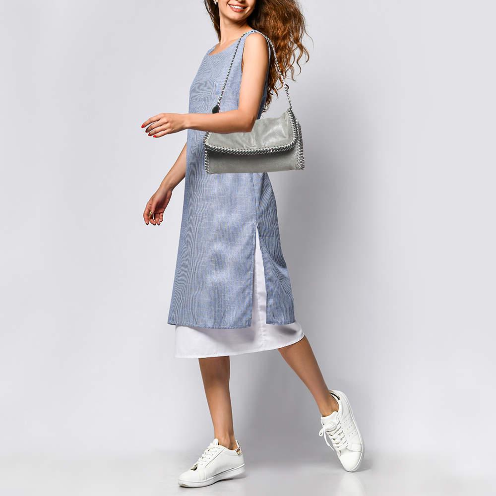 Designer bags are ideal companions for ample occasions Here we have a fashion meets functionality piece crafted with precision. It has been equipped with a well sized interior that can easily fit your small essentials.