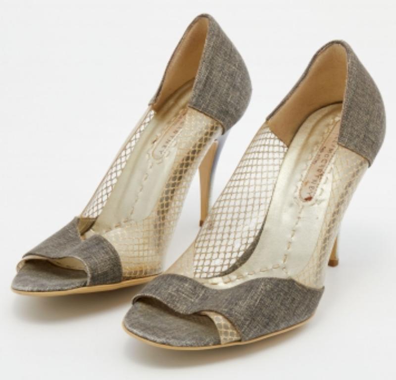 Artistic skill and feminine sophistication take center stage in these beautiful pumps from Stella McCartney! They have been crafted from canvas and PVC and feature peep-toes with a slip-on style. They come equipped with comfortable faux leather