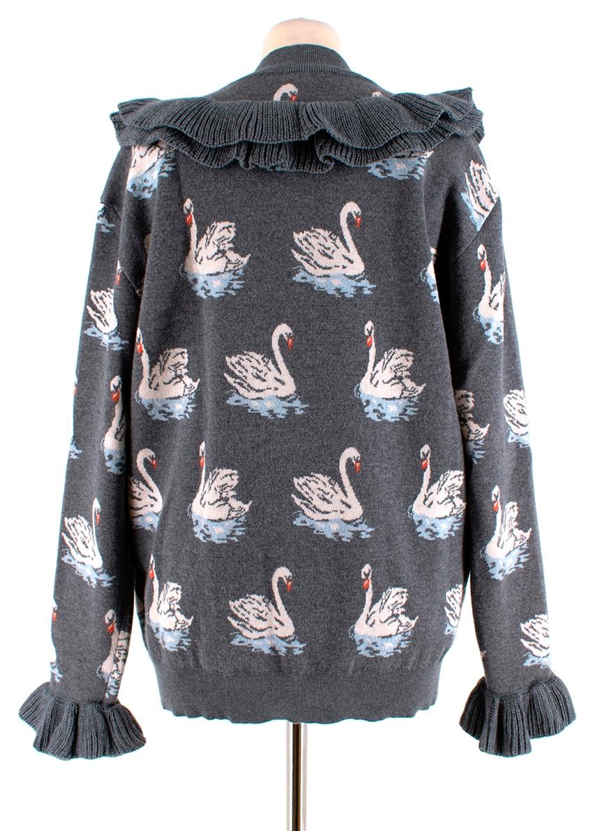 Stella McCartney Grey Swan Intarsia Ruffled Jumper

- Ribbed ruffle trim at sleeves and v shape chest
- Swan motifs
- Crew neck 

Materials:
100% Virgin Wool

Made in Italy 
Dry Clean
Measurements are taken laying flat, seam to seam.