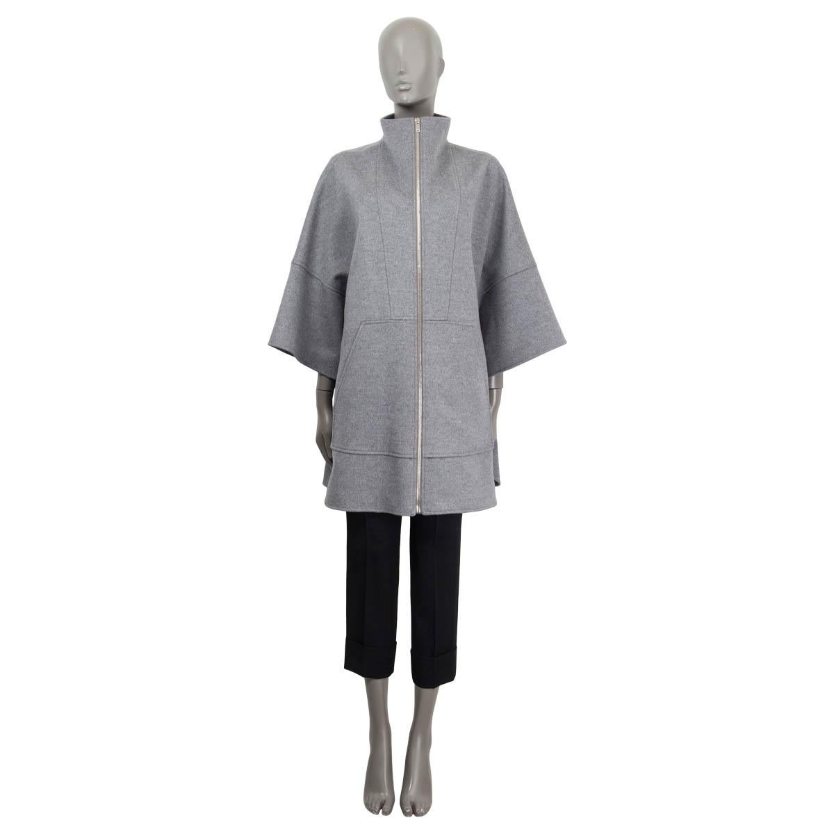 100% authentic Stella McCartney zipped cape coat in light grey wool (100%) featuring two big front pockets and open side parts. Unlined. Has been worn once and is in virtually new condition. 

Measurements
Tag Size	40
Size	S
Shoulder Width	50cm