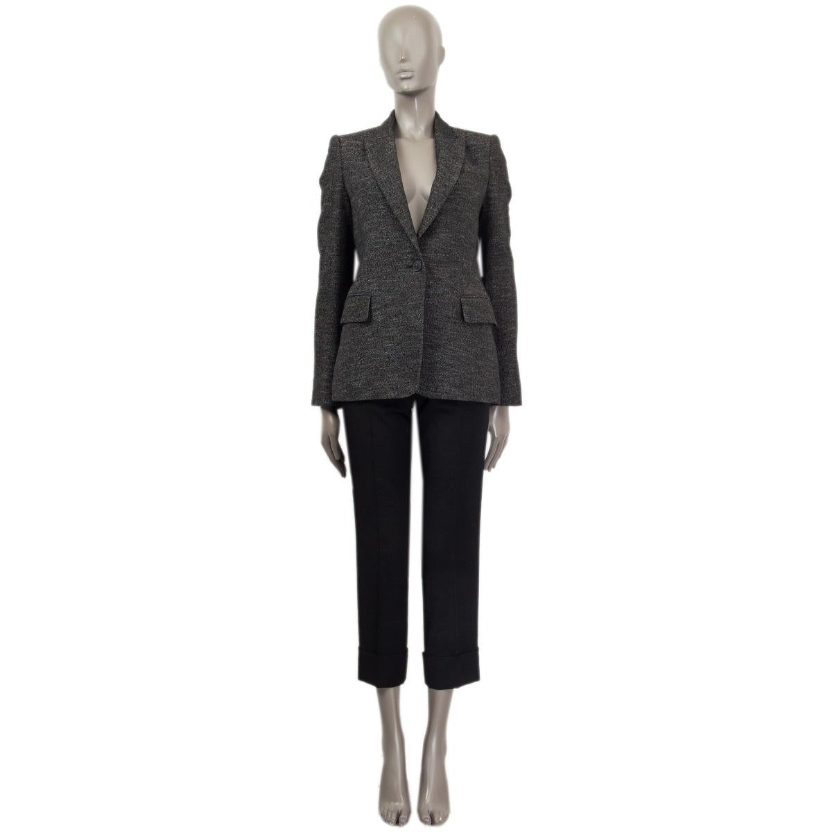 100% authentic Stella McCartney single-button blazer in gray viscose (71%), cotton (27%) and polyester (2%) with metallic lurex fibres. Features a peak lapel and flap pockets. Lined in black viscose (52%) and cotton (48%). Has been worn and is in