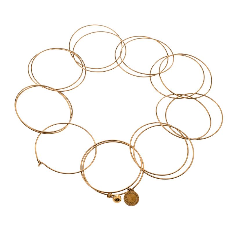 Add a truly elegant touch to your jewellery collection with this Stella McCartney piece that personifies style in a classy way. The piece is styled as a choker and designed with multiple interlocking circles along with an engraved tag accent. It is