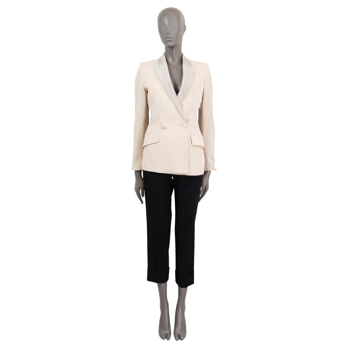 100% authentic Stella McCartney two button grosgrain peak collar blazer in ivory and light grey wool (100%). Features two flap pockets on the front and one chest pocket. Lined in ivory (100%). Has been worn and is in excellent
