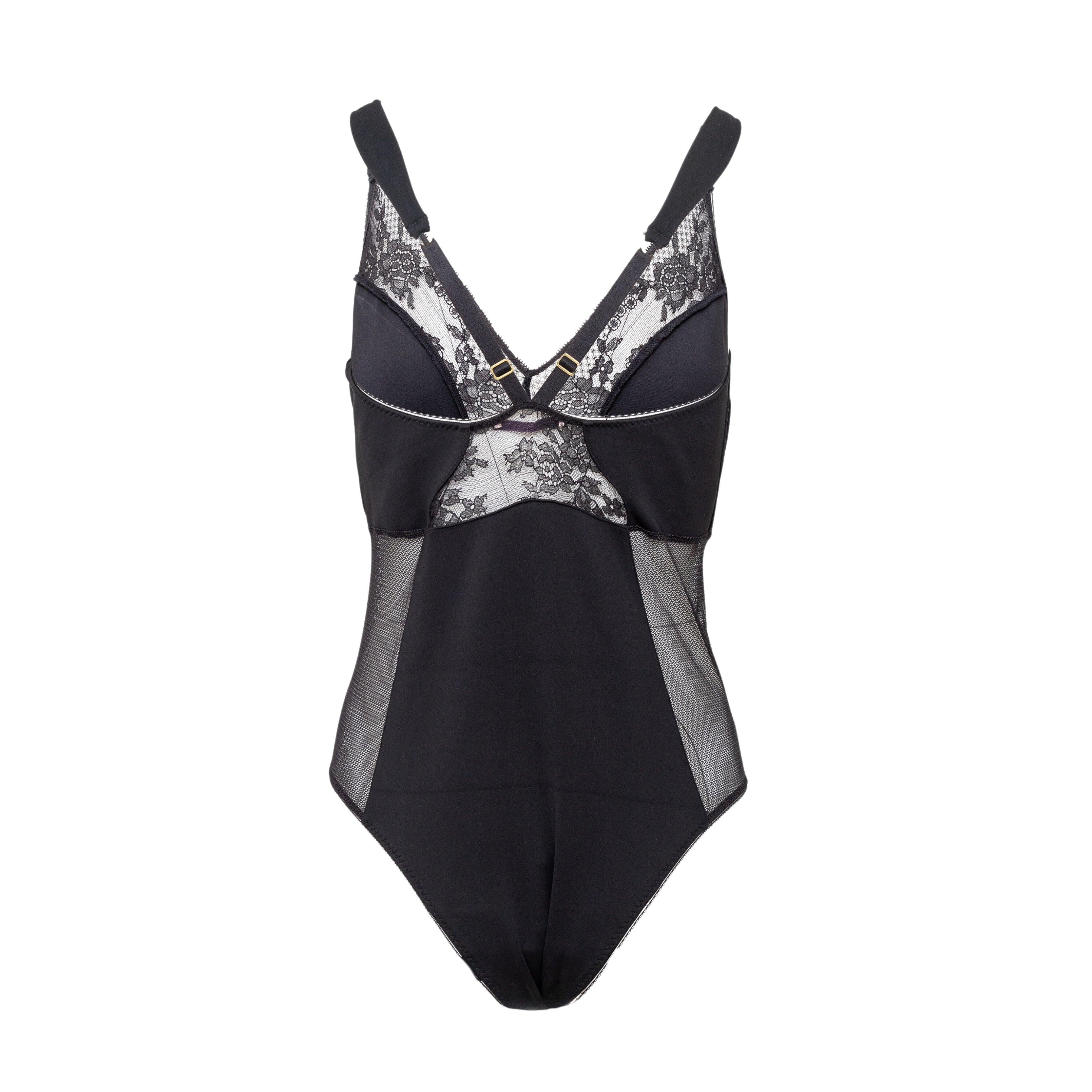 Expertly crafted with recycled nylon mesh and delicate lace details, the Stella McCartney Lace & Mesh Bodysuit offers a sleek, fitted silhouette and feminine touch to any ensemble. Perfect as a bodysuit, a daring choice for a night