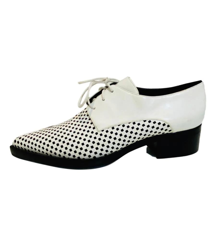 Stella McCartney Lace Up Oxfords

Vegan Leather in black and white. Pointed with chequered pattern to front. Black block heel.

Additional information:
Size – 40
Condition – Very Good 
Comes with- Dust bag