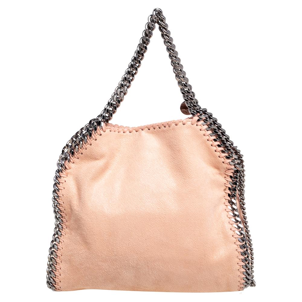 This Falabella shoulder bag from Stella McCartney will make the dream of countless women come true. Crafted from faux suede, it is durable and stylish. While the chain, star, and fringe detailing elevate its beauty, the faux suede & fabric-lined
