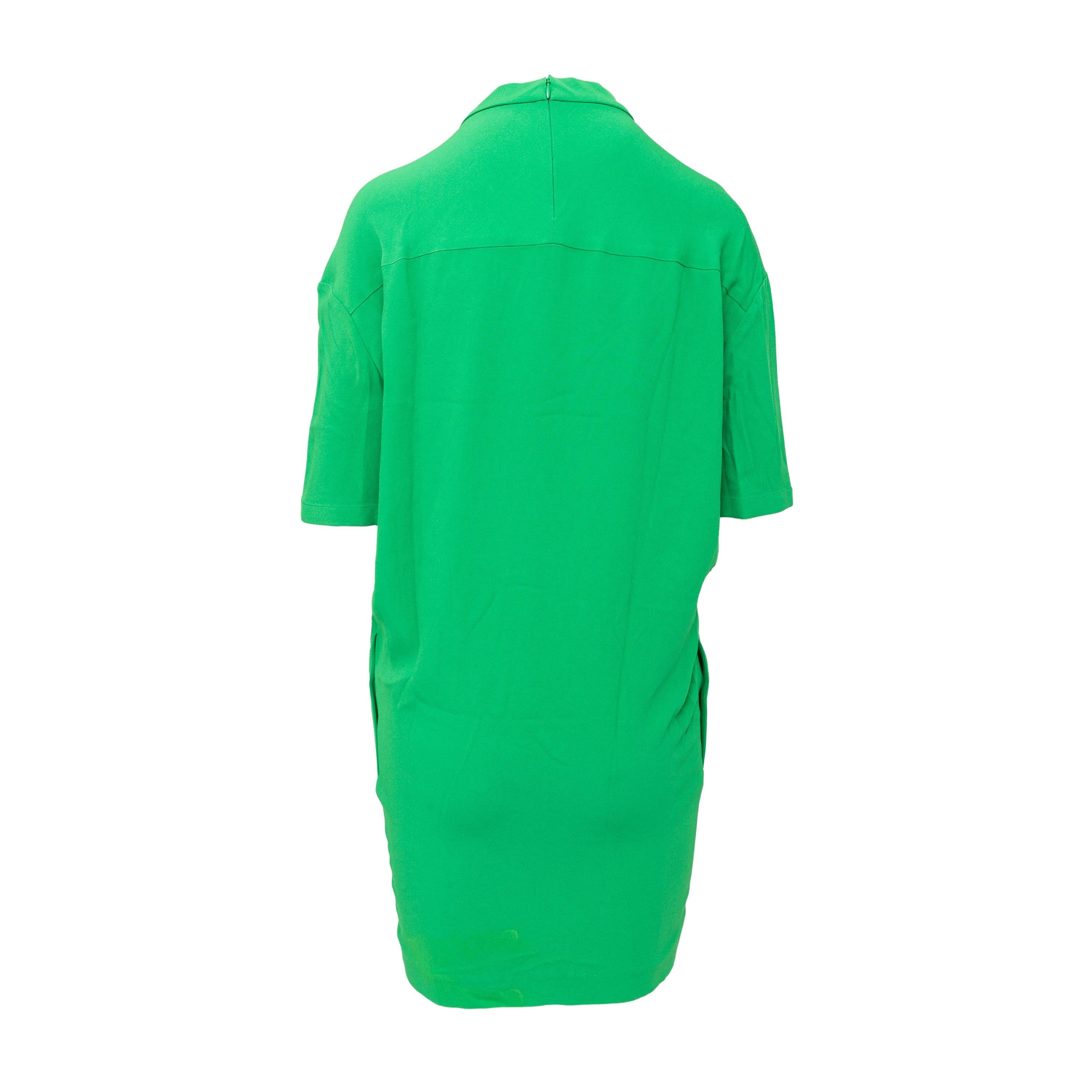 This Stella McCartney long top in a bright apple green color is made from a comfortable rayon and acetate blend fabric. The round neckline and relaxed shoulders give a casual yet stylish look, complemented by the half sleeve. With a half zip at the