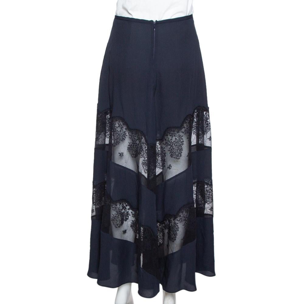 Stella McCartney has designed this skirt, exuding a chic appeal, to a maxi length with beautiful lace panels all over giving the dress a layered look. Exuding feminine aesthetics and a midnight blue hue, the skirt is ultra-stylish and elegant. It