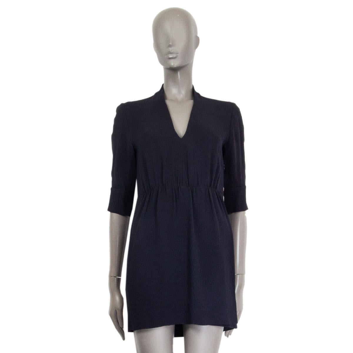 authentic Stella McCartney double layer in midnight blue viscose (79%) acetate (21%) with detailed cut-out and the back of the sleeve, V-neckline and a gathered waistband. Unlined. Closes with a concealed zipper on the left side. Has been worn and