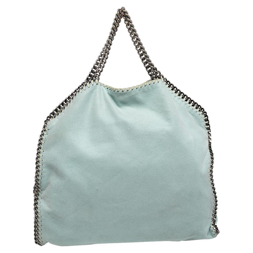 This Falabella tote from Stella McCartney will make the dream of countless women come true. Crafted from faux leather, it is durable and stylish. While the chain detailing elevate its beauty, the nylon-lined interior will dutifully hold all your