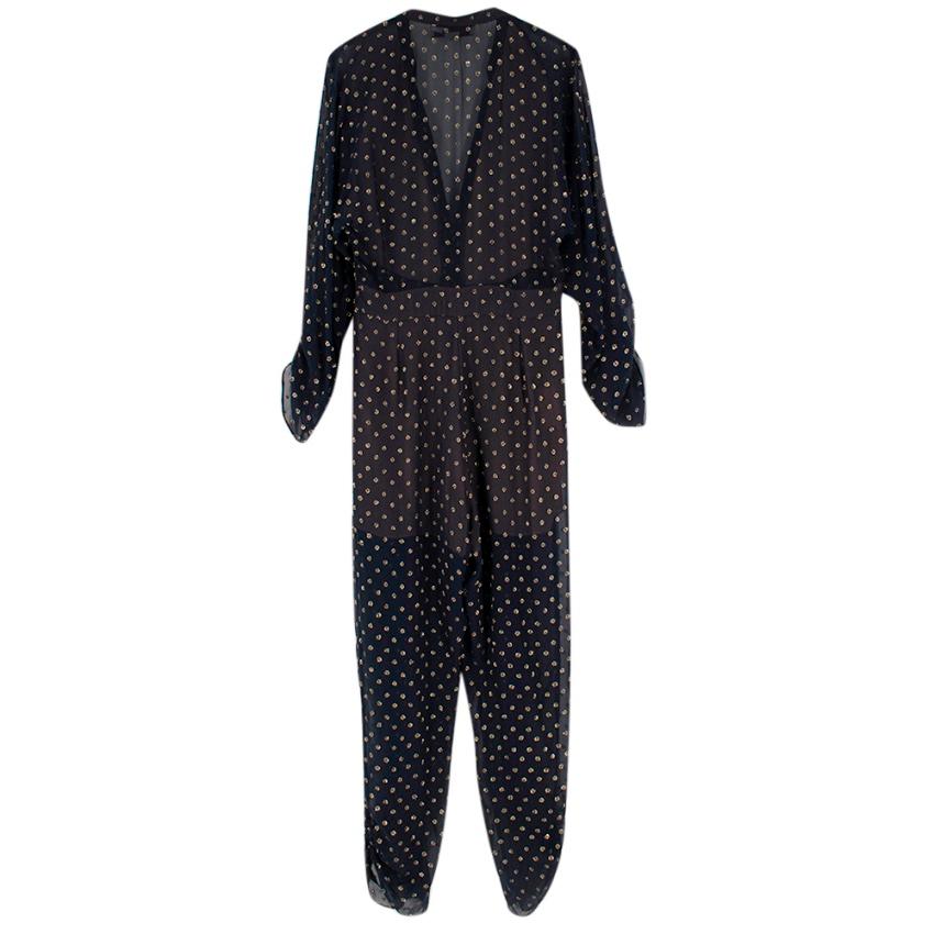 Stella McCartney Gold Dotted Tie-Front Tapered Jumpsuit.   £1470

This sheer, midnight-blue version of Stella McCartney's signature Monia jumpsuit is detailed with a gold polka-dot jacquard that's perfect for the party season. It features a visible