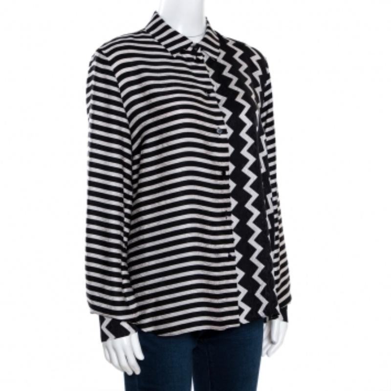 From Stella McCartney, this stylish shirt is cut from pure silk. It comes in a monochrome scheme and has a stripe pattern. It is styled with long sleeves, button front, simple collar and a tailored fit. It is great for outings with friends and will
